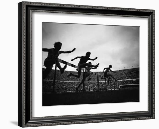 Action During the Women's 100m Hurdles at the 1952 Olympic Games in Helsinki-Mark Kauffman-Framed Photographic Print