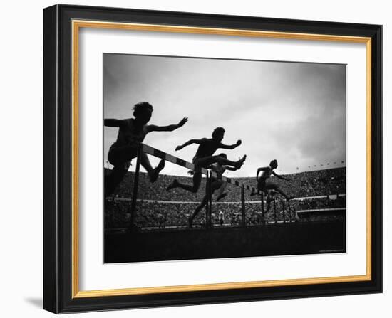 Action During the Women's 100m Hurdles at the 1952 Olympic Games in Helsinki-Mark Kauffman-Framed Photographic Print