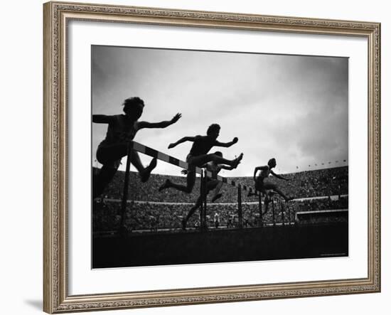 Action During the Women's 100m Hurdles at the 1952 Olympic Games in Helsinki-Mark Kauffman-Framed Photographic Print