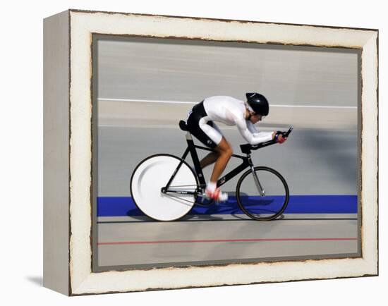 Action of Female Cyclist Competing on the Velodrome-null-Framed Premier Image Canvas