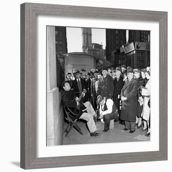 Activist Folk Musician Woody Guthrie Playing for a Crowd of New Yorkers-null-Framed Premium Photographic Print