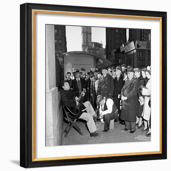 Activist Folk Musician Woody Guthrie Playing for a Crowd of New Yorkers-null-Framed Premium Photographic Print