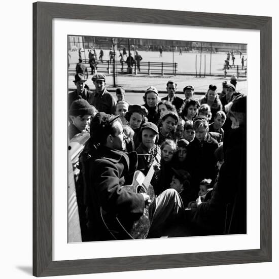 Activist Folk Musician Woody Guthrie Playing for a Crowd of Young New Yorkers in a Park-null-Framed Premium Photographic Print