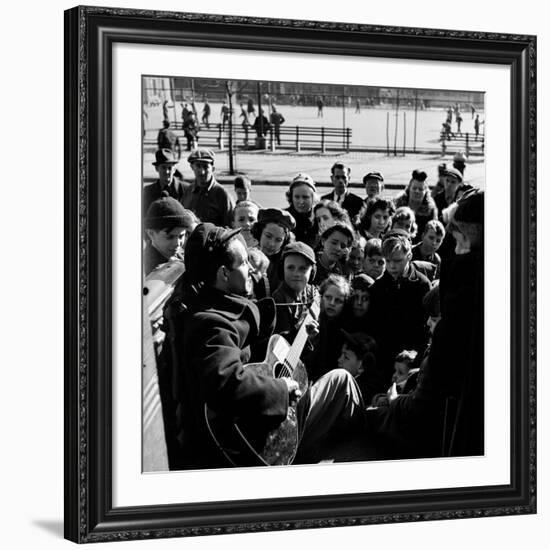 Activist Folk Musician Woody Guthrie Playing for a Crowd of Young New Yorkers in a Park-null-Framed Premium Photographic Print