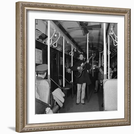 Activist Folk Musician Woody Guthrie Playing for a Subway Car of New Yorkers-Eric Schaal-Framed Premium Photographic Print