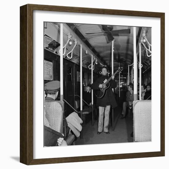 Activist Folk Musician Woody Guthrie Playing for a Subway Car of New Yorkers-Eric Schaal-Framed Premium Photographic Print