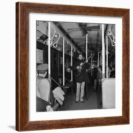 Activist Folk Musician Woody Guthrie Playing for a Subway Car of New Yorkers-Eric Schaal-Framed Premium Photographic Print