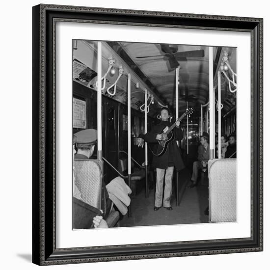 Activist Folk Musician Woody Guthrie Playing for a Subway Car of New Yorkers-Eric Schaal-Framed Premium Photographic Print