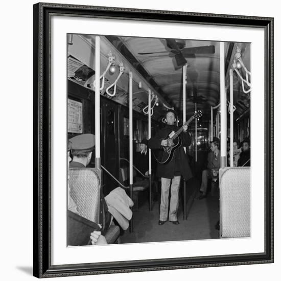 Activist Folk Musician Woody Guthrie Playing for a Subway Car of New Yorkers-Eric Schaal-Framed Premium Photographic Print