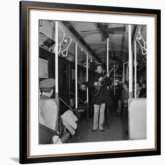 Activist Folk Musician Woody Guthrie Playing for a Subway Car of New Yorkers-Eric Schaal-Framed Premium Photographic Print