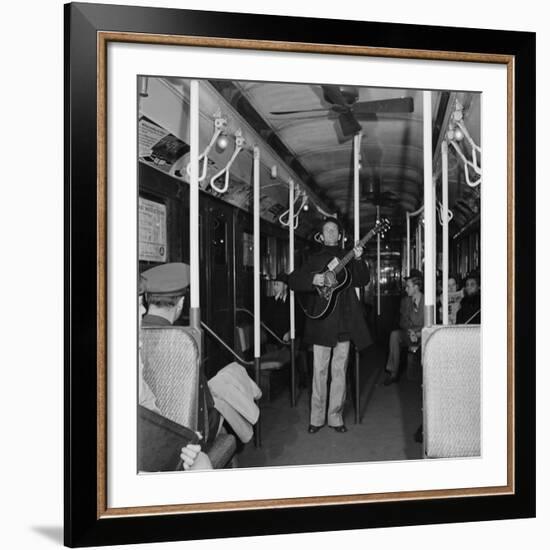 Activist Folk Musician Woody Guthrie Playing for a Subway Car of New Yorkers-Eric Schaal-Framed Premium Photographic Print