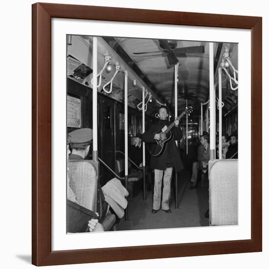 Activist Folk Musician Woody Guthrie Playing for a Subway Car of New Yorkers-Eric Schaal-Framed Premium Photographic Print