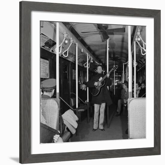 Activist Folk Musician Woody Guthrie Playing for a Subway Car of New Yorkers-Eric Schaal-Framed Premium Photographic Print