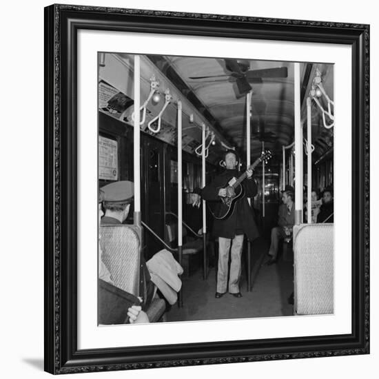 Activist Folk Musician Woody Guthrie Playing for a Subway Car of New Yorkers-Eric Schaal-Framed Premium Photographic Print