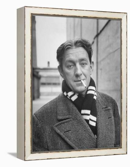 Actor Alec Guinness Dangling Cigarette from His Lips, on Movie Lot-Alfred Eisenstaedt-Framed Premier Image Canvas