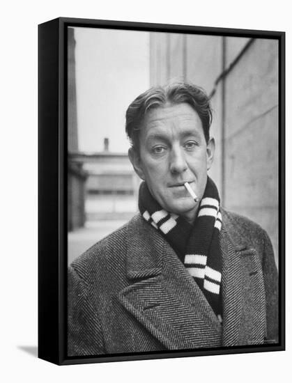Actor Alec Guinness Dangling Cigarette from His Lips, on Movie Lot-Alfred Eisenstaedt-Framed Premier Image Canvas