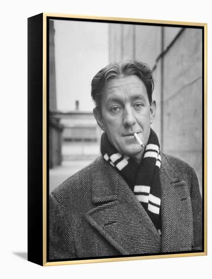 Actor Alec Guinness Dangling Cigarette from His Lips, on Movie Lot-Alfred Eisenstaedt-Framed Premier Image Canvas