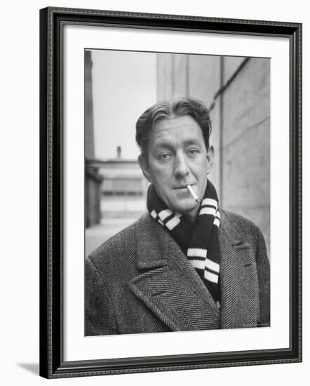 Actor Alec Guinness Dangling Cigarette from His Lips, on Movie Lot-Alfred Eisenstaedt-Framed Premium Photographic Print