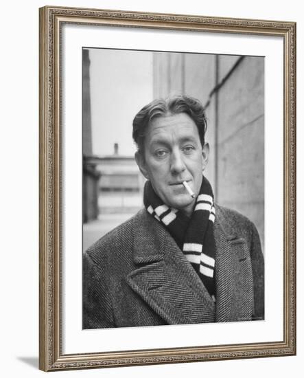 Actor Alec Guinness Dangling Cigarette from His Lips, on Movie Lot-Alfred Eisenstaedt-Framed Premium Photographic Print