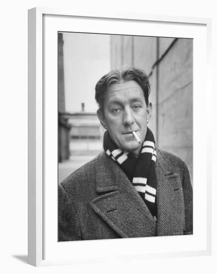 Actor Alec Guinness Dangling Cigarette from His Lips, on Movie Lot-Alfred Eisenstaedt-Framed Premium Photographic Print