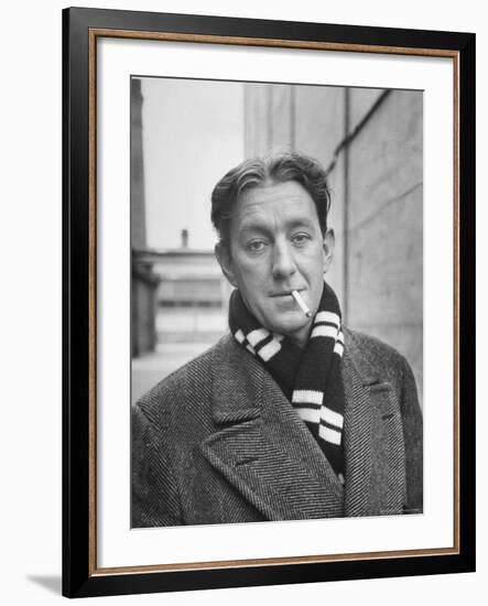 Actor Alec Guinness Dangling Cigarette from His Lips, on Movie Lot-Alfred Eisenstaedt-Framed Premium Photographic Print