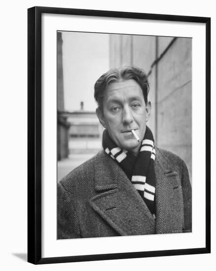 Actor Alec Guinness Dangling Cigarette from His Lips, on Movie Lot-Alfred Eisenstaedt-Framed Premium Photographic Print