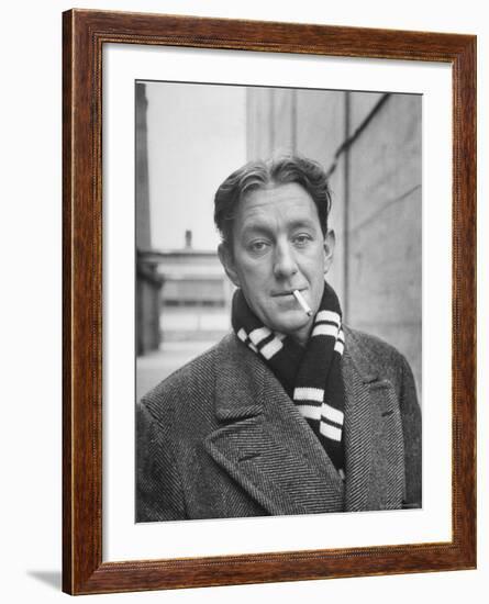 Actor Alec Guinness Dangling Cigarette from His Lips, on Movie Lot-Alfred Eisenstaedt-Framed Premium Photographic Print