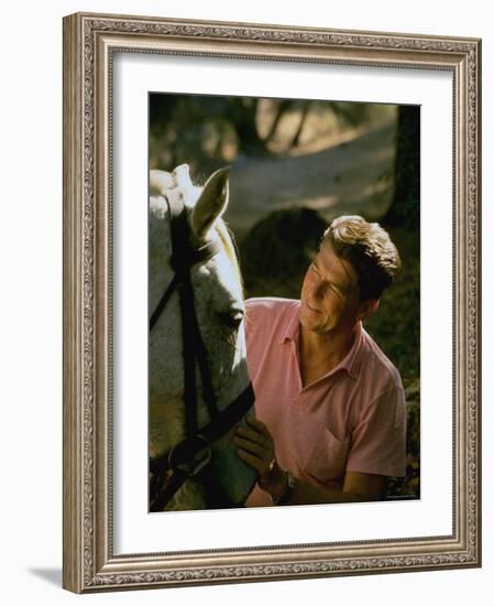 Actor and California Gubernatorial Candidate Ronald Reagan Petting Horse Outside on Ranch at Home-Bill Ray-Framed Photographic Print