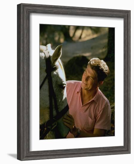 Actor and California Gubernatorial Candidate Ronald Reagan Petting Horse Outside on Ranch at Home-Bill Ray-Framed Photographic Print