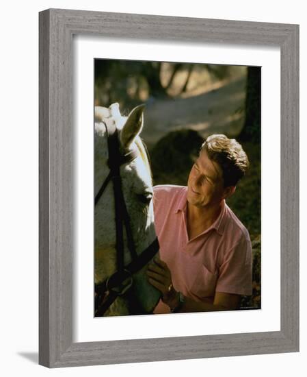 Actor and California Gubernatorial Candidate Ronald Reagan Petting Horse Outside on Ranch at Home-Bill Ray-Framed Photographic Print