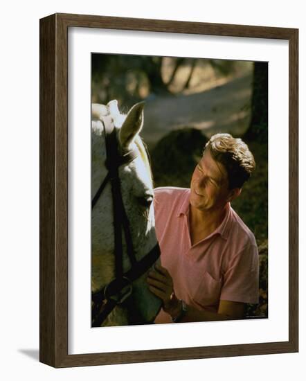 Actor and California Gubernatorial Candidate Ronald Reagan Petting Horse Outside on Ranch at Home-Bill Ray-Framed Photographic Print