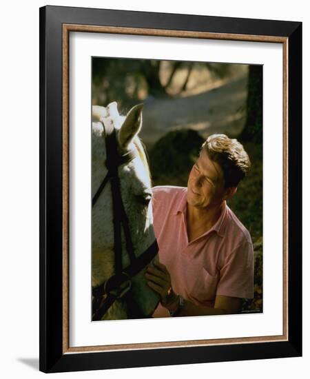 Actor and California Gubernatorial Candidate Ronald Reagan Petting Horse Outside on Ranch at Home-Bill Ray-Framed Photographic Print