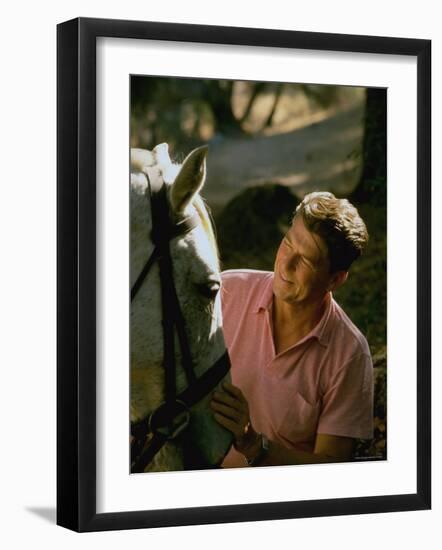 Actor and California Gubernatorial Candidate Ronald Reagan Petting Horse Outside on Ranch at Home-Bill Ray-Framed Photographic Print