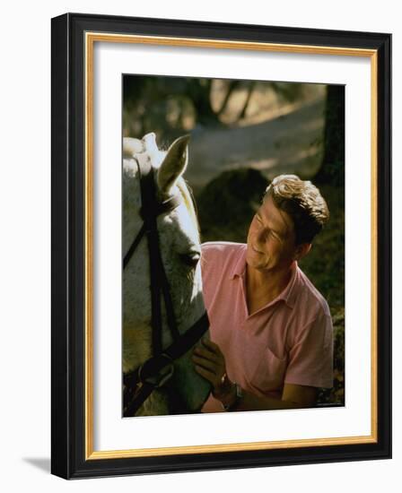 Actor and California Gubernatorial Candidate Ronald Reagan Petting Horse Outside on Ranch at Home-Bill Ray-Framed Photographic Print