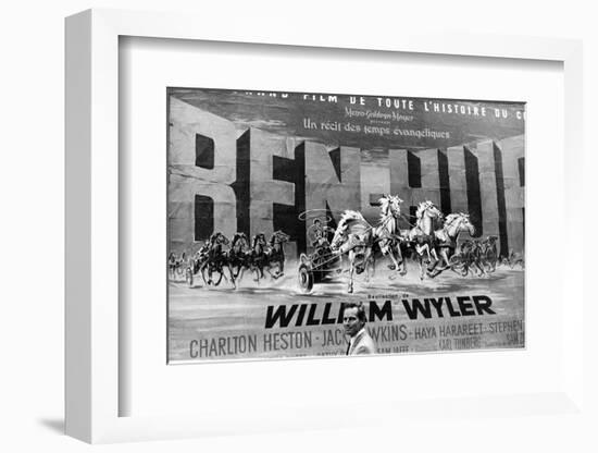 Actor Charlton Heston Posing in Front of Billboard of Film, Ben Hur-null-Framed Photographic Print