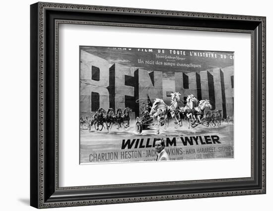 Actor Charlton Heston Posing in Front of Billboard of Film, Ben Hur-null-Framed Photographic Print