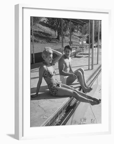 Actor Cornel Wilde and His Wife, Patricia, Sitting by the Pool-null-Framed Photographic Print