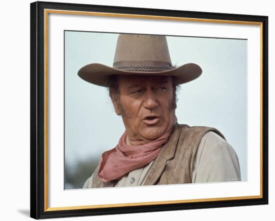 Actor John Wayne During Filming of Western Movie "The Undefeated"-John Dominis-Framed Premium Photographic Print