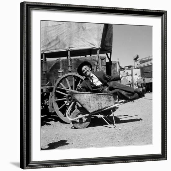 Actor Kirk Douglas Clowning on the Set of the Western Action Film "Gunfight at O.K. Corral"-Ralph Crane-Framed Premium Photographic Print