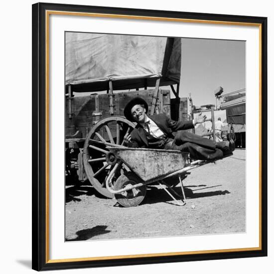 Actor Kirk Douglas Clowning on the Set of the Western Action Film "Gunfight at O.K. Corral"-Ralph Crane-Framed Premium Photographic Print