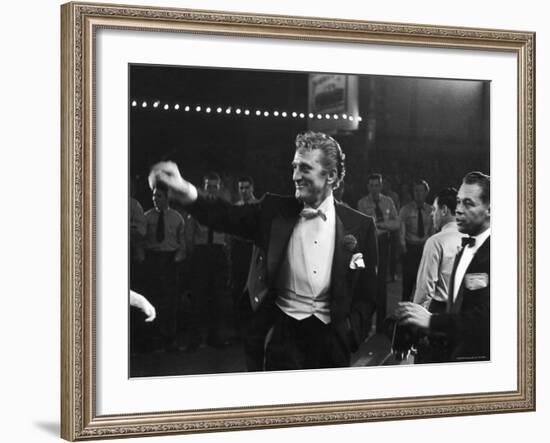 Actor Kirk Douglas, Smiling and Waving as He Enters RKO Pantages Theatre, For the Academy Awards-Ed Clark-Framed Premium Photographic Print