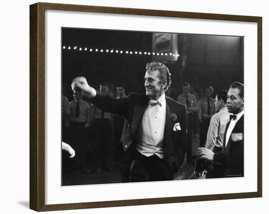 Actor Kirk Douglas, Smiling and Waving as He Enters RKO Pantages Theatre, For the Academy Awards-Ed Clark-Framed Premium Photographic Print