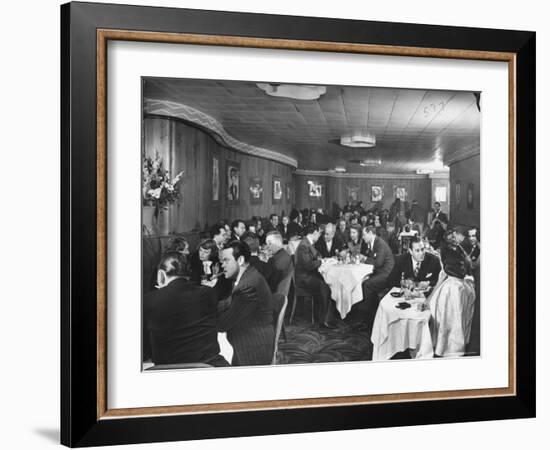 Actor Orson Welles at Table on Left with Cigar in His Mouth-Alfred Eisenstaedt-Framed Premium Photographic Print