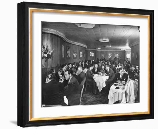 Actor Orson Welles at Table on Left with Cigar in His Mouth-Alfred Eisenstaedt-Framed Premium Photographic Print