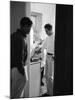 Actor Paul Newman Cooking Eggs for Guests Incl. Anthony Perkins During an Informal Party-null-Mounted Premium Photographic Print