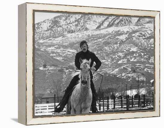 Actor Robert Redford Exercising One of His Eight Saddle Horses on His Remote Mountain Ranch-John Dominis-Framed Premier Image Canvas