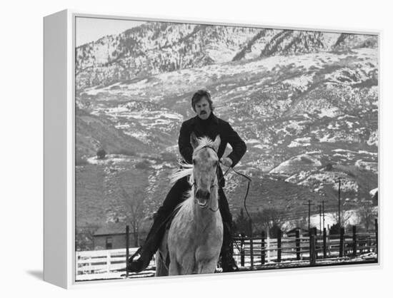 Actor Robert Redford Exercising One of His Eight Saddle Horses on His Remote Mountain Ranch-John Dominis-Framed Premier Image Canvas