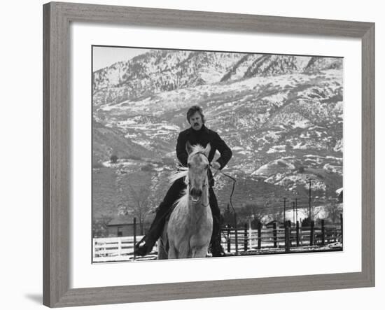 Actor Robert Redford Exercising One of His Eight Saddle Horses on His Remote Mountain Ranch-John Dominis-Framed Premium Photographic Print