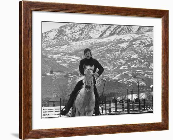 Actor Robert Redford Exercising One of His Eight Saddle Horses on His Remote Mountain Ranch-John Dominis-Framed Premium Photographic Print