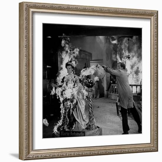 Actor Vincent Price Putting Out Fire in Film "House of Wax"-J^ R^ Eyerman-Framed Premium Photographic Print